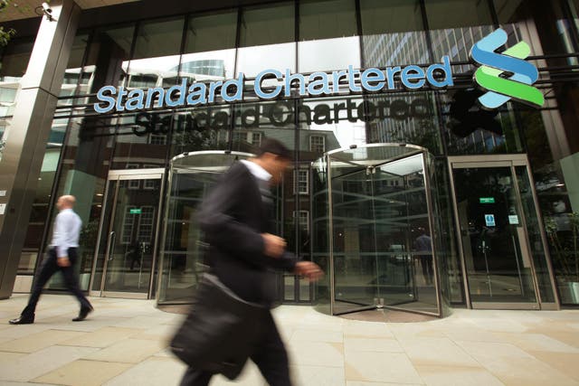 Shares in global bank Standard Chartered have jumped (Yui Mok/ PA)