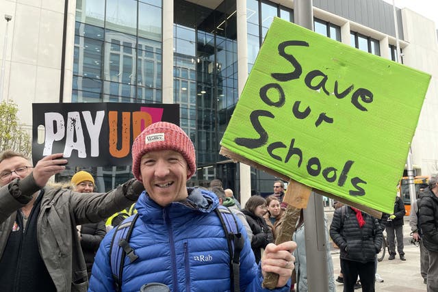 Lewis Miles, 38, a teacher at Peter Lea Primary in Fairwater, Cardiff, joins protesters from the National Education Union (NEU) (Bronwen Weatherby/PA)