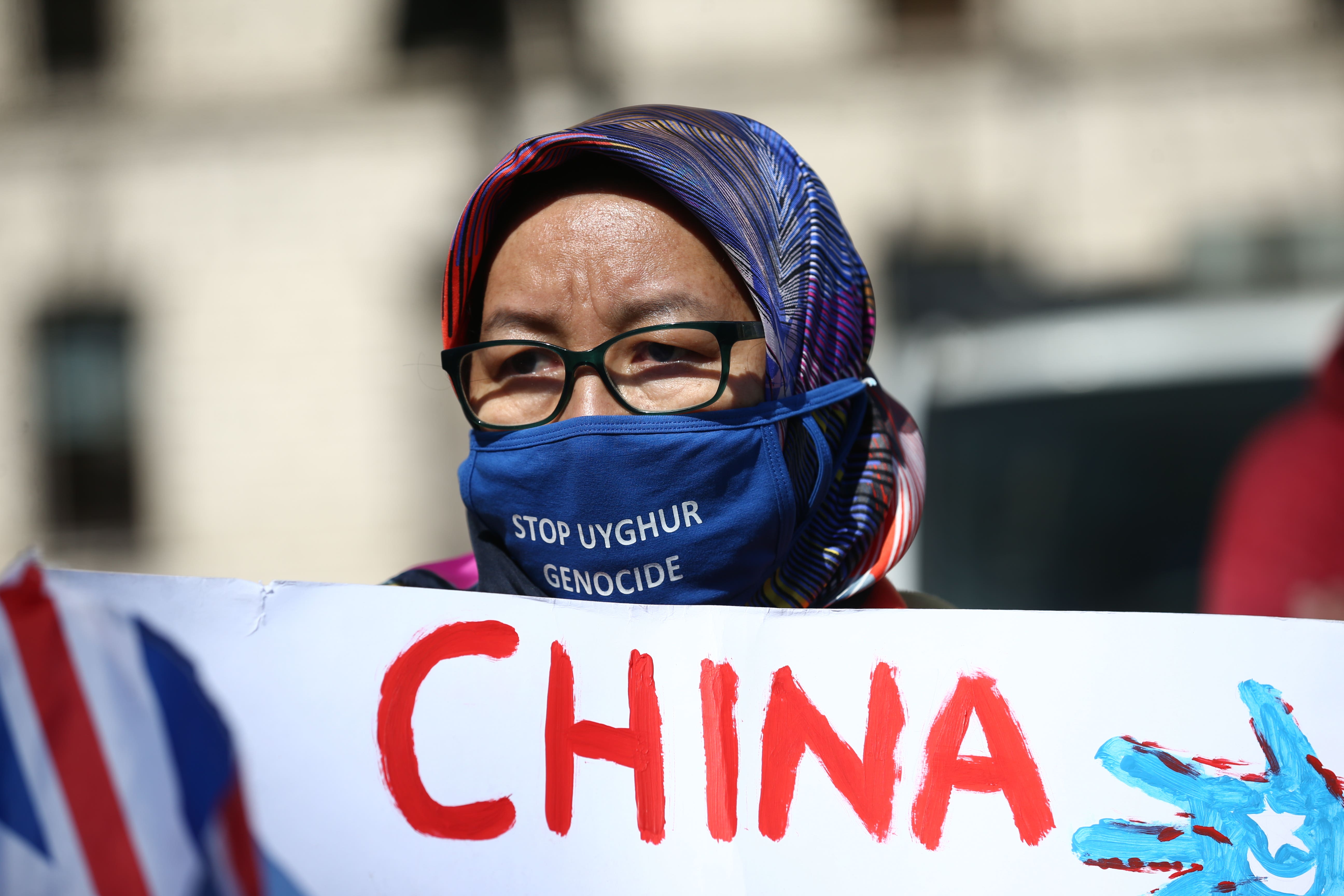 A Uighur woman during a demonstration in Parliament Square, London