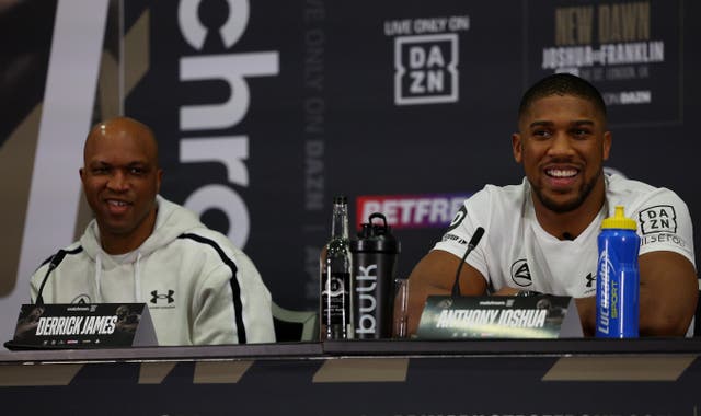 <p>Joshua (right) with his new coach Derrick James</p>