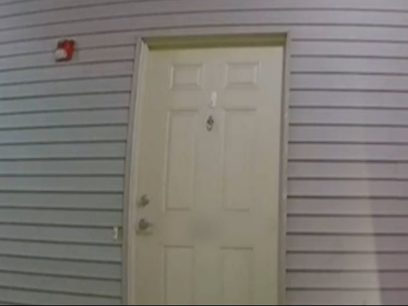 An image of a door in the neighborhood where Sayreville City Councilwoman Eunice Dwumfour was shot and killed. The video captures the sound of the gunshots the night of her death
