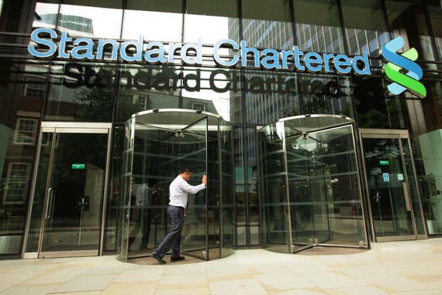 Shares in global bank Standard Chartered have dipped after First Abu Dhabi Bank (FAB) confirmed that a takeover offer is not currently on the cards (Yui Mok/ PA)