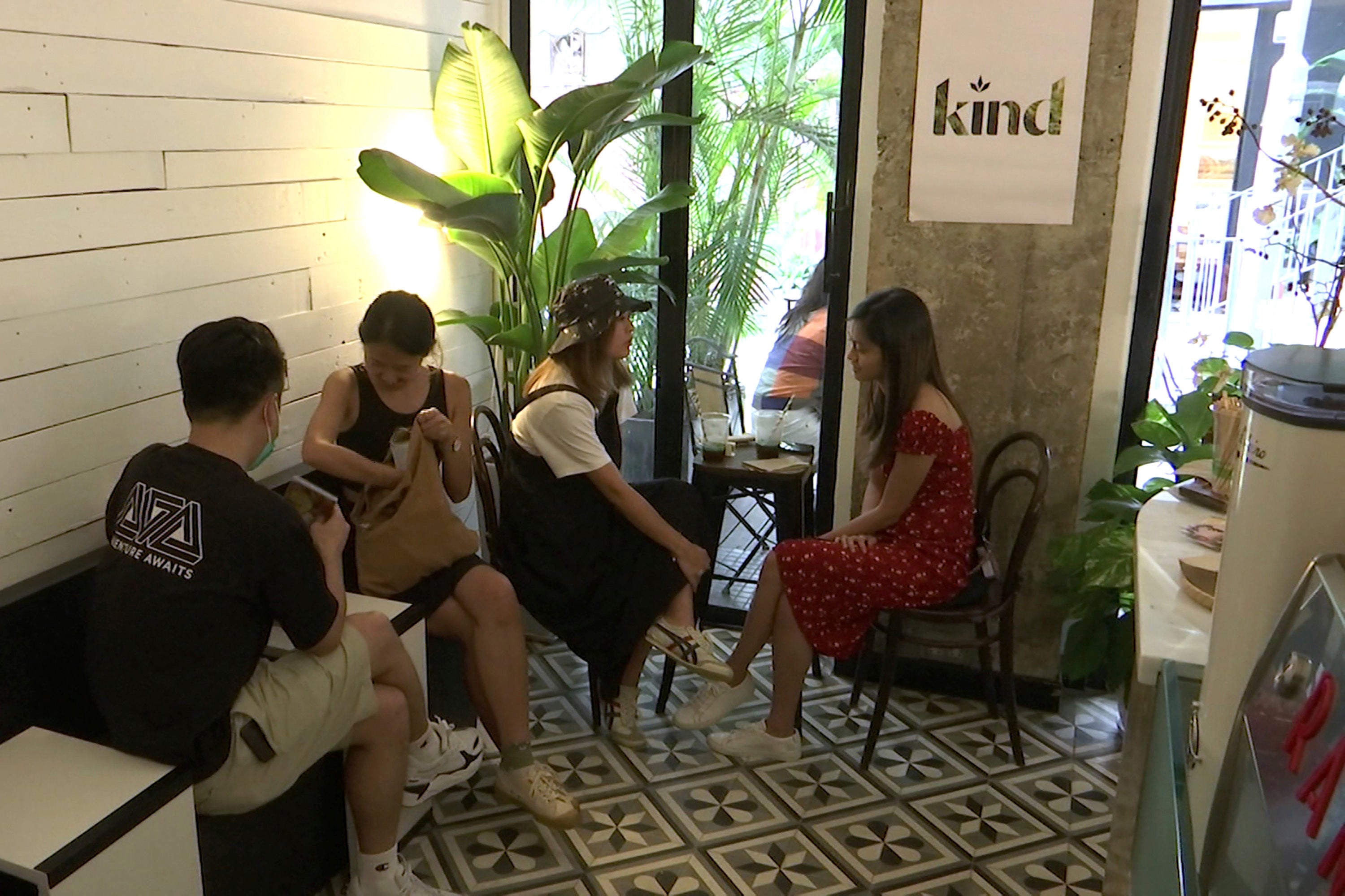 Customers sit at tables in Hong Kong's first CBD cafe