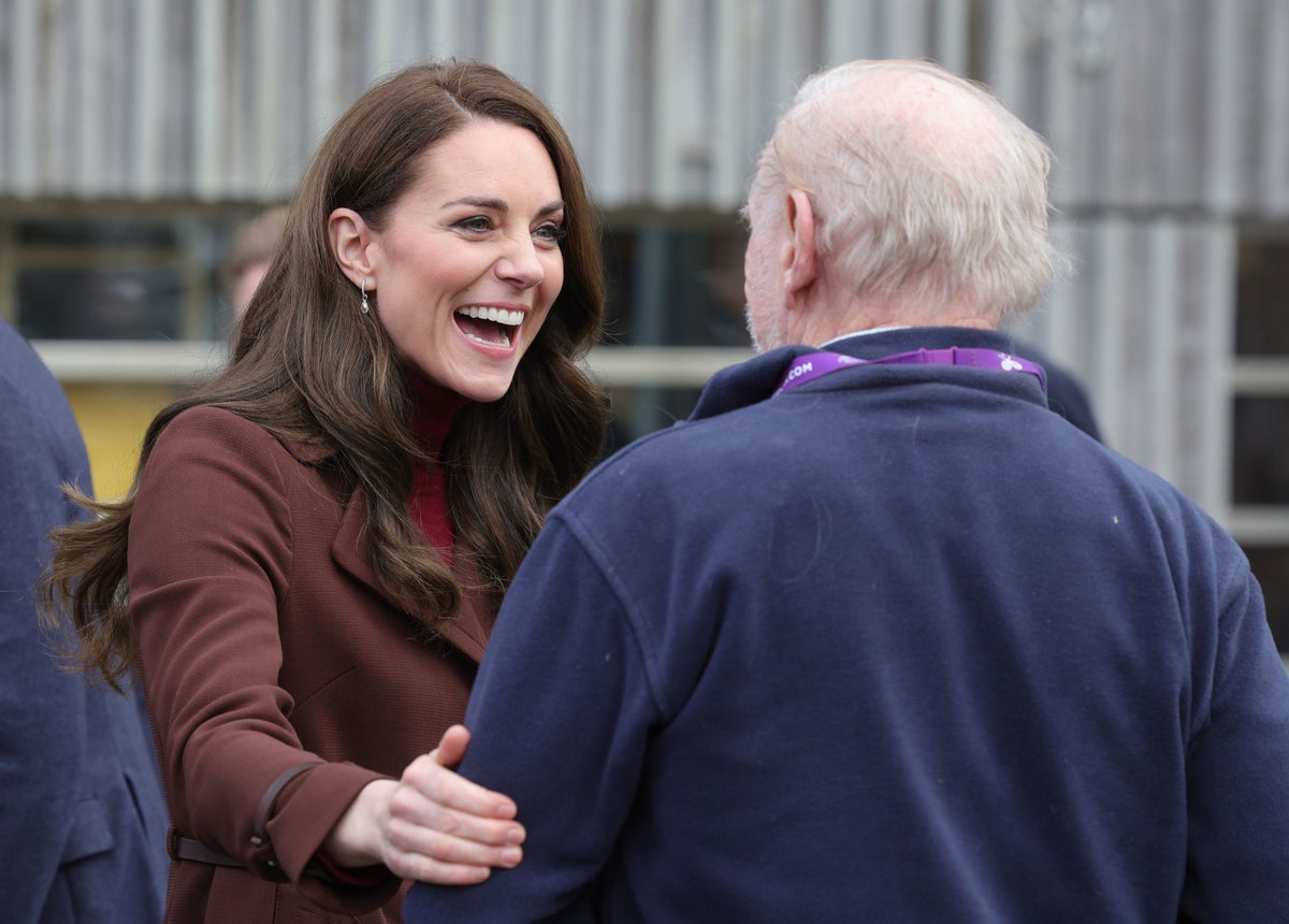 Kate Middleton embraces ex-history teacher after Prince Harry claims she is not a hugger