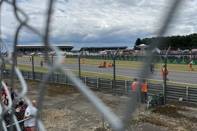 The protesters on the track at Silverstone (Helena Hicks/PA)