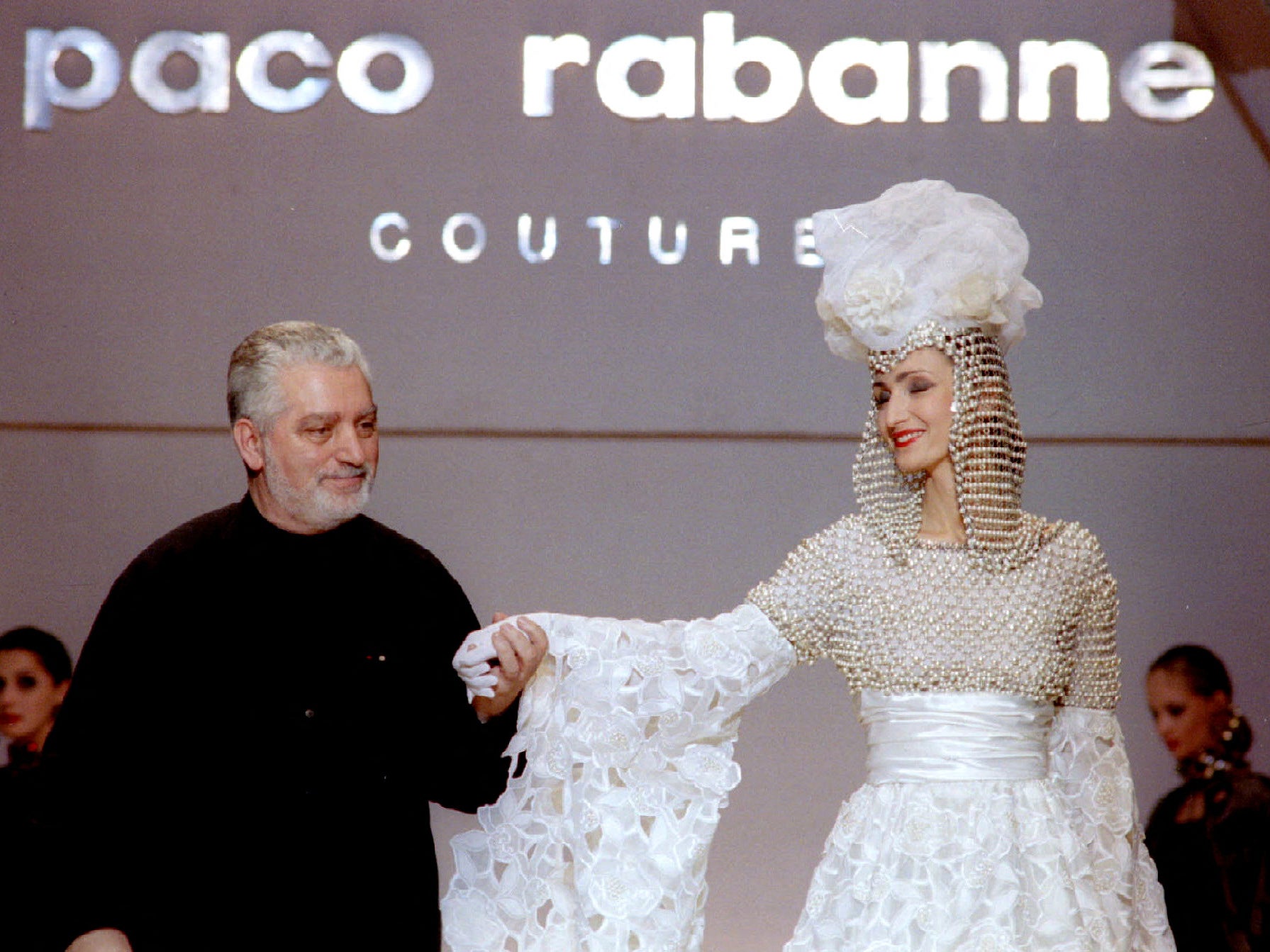 Paco Rabanne with one of his models at the finale of a show at Rossiya Hotel in Moscow