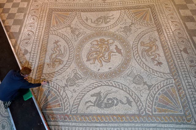 Mosaic of Cupid riding on a dolphin, which was first laid in AD150, at Fishbourne Roman Palace in Chichester. (Andrew Matthews/PA)