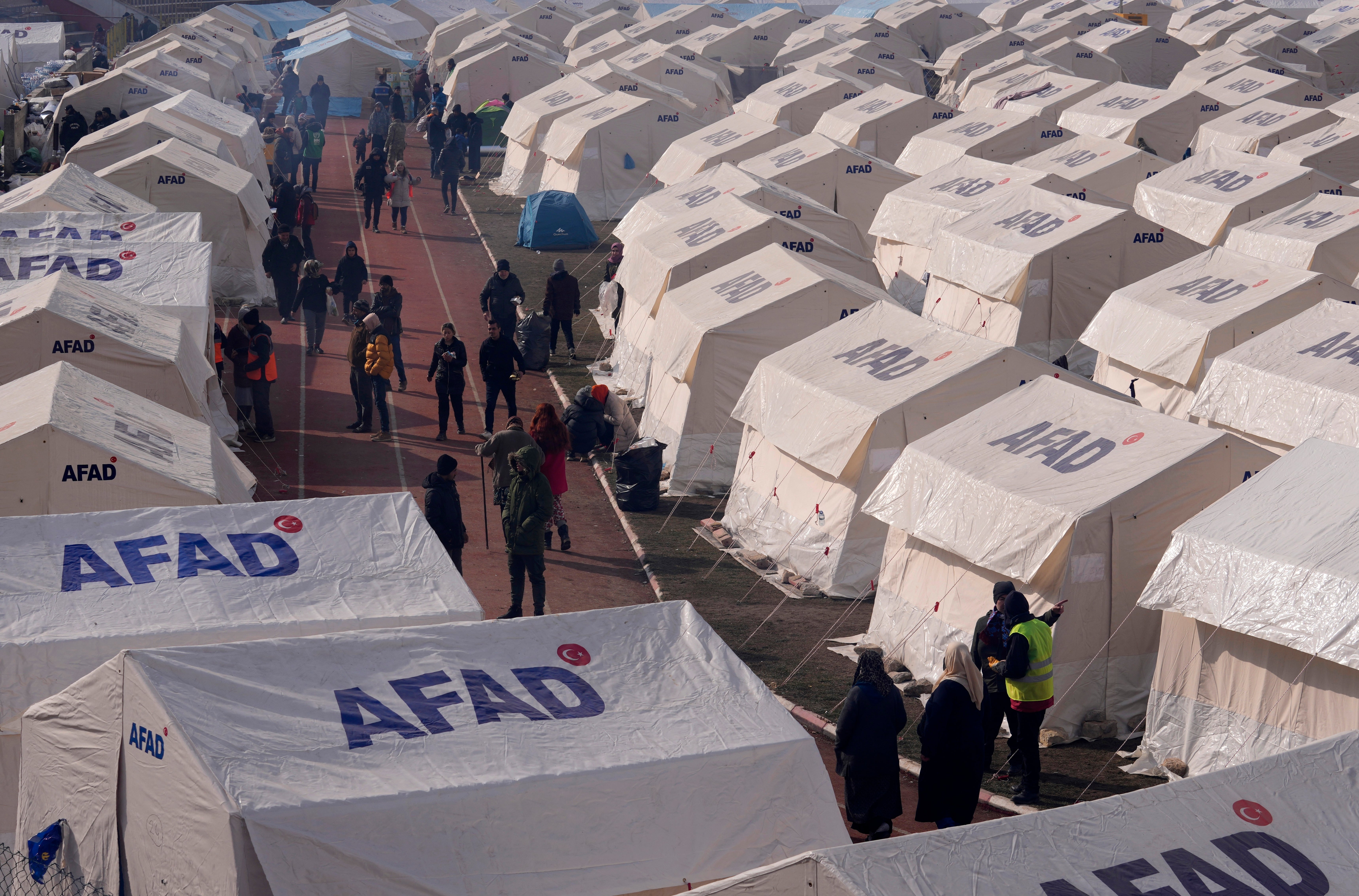 People with their belongings arrived at the tents in Kharamanmaras, southeastern Turkey today