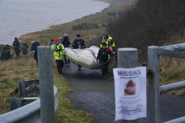 The police Search and Rescue team on the river bank near to Shard Bridge on the River Wyre in Lancashire (PA)