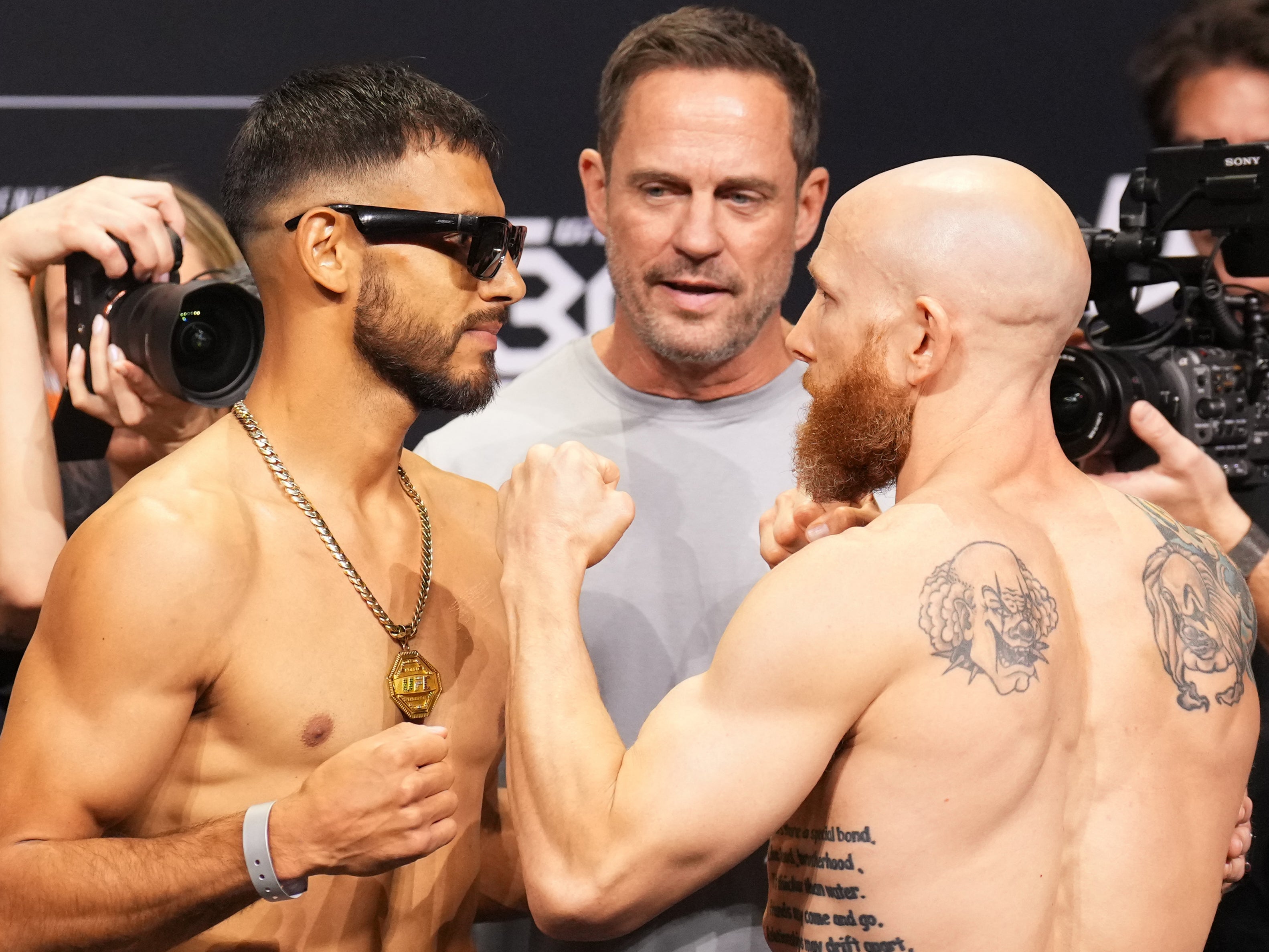 Yair Rodriguez (left) faces off with Josh Emmett ahead of their co-main event