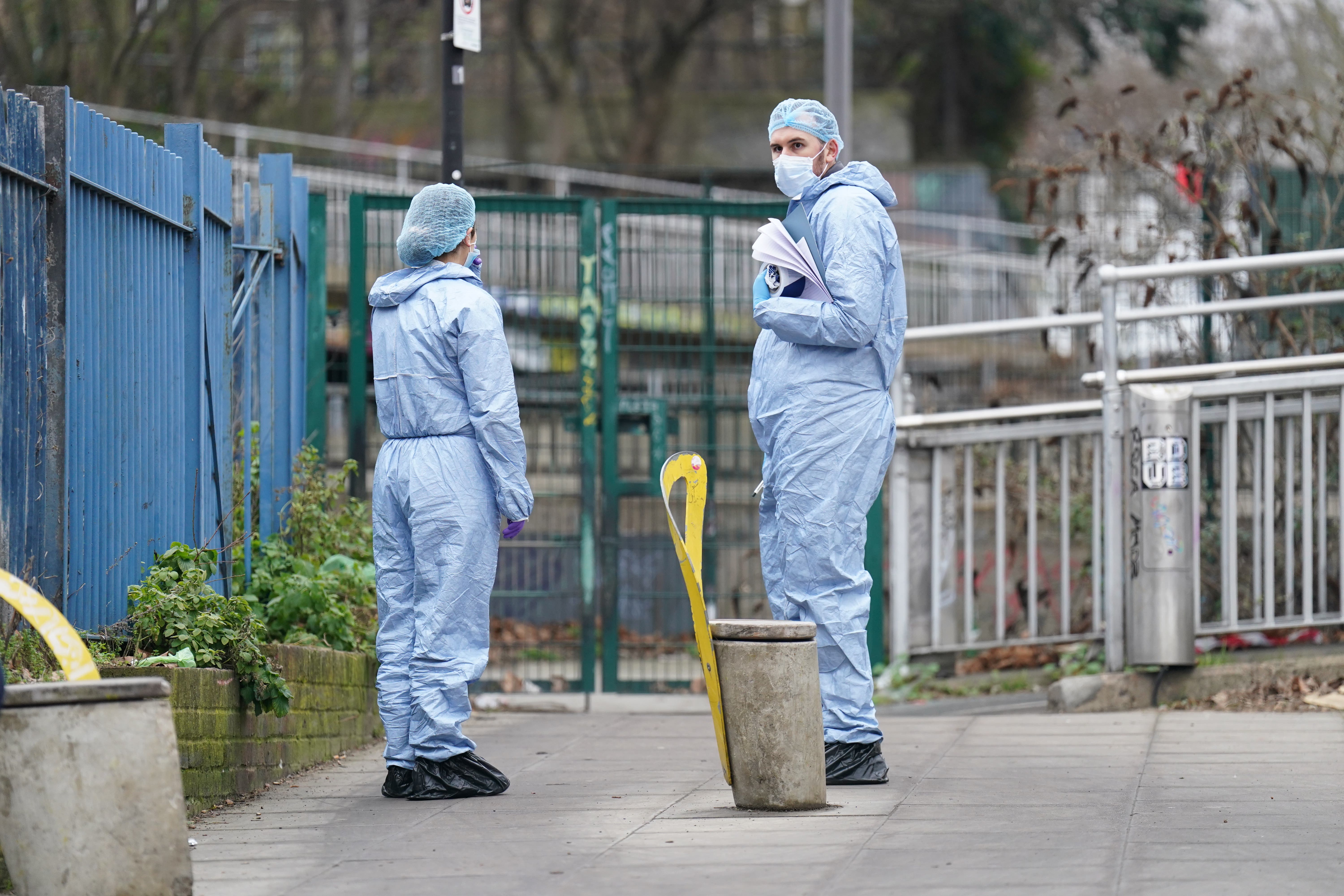 Police forensics officers at the scene at White Post Lane, Hackney Wick, east London (James Manning/PA)