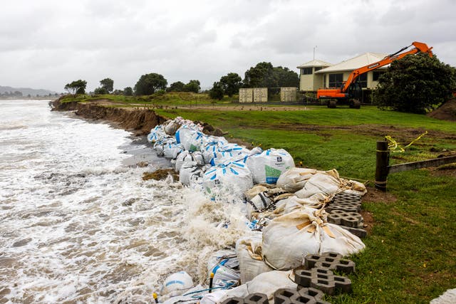 <p>Sand bags are placed along the coastline as Cyclone Gabrielle buffets the Coromandel, south of Auckland, Sunday</p>