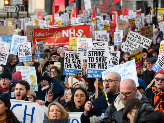 <p>Nursing staff and supporters march during a strike over pay in 2013</p>