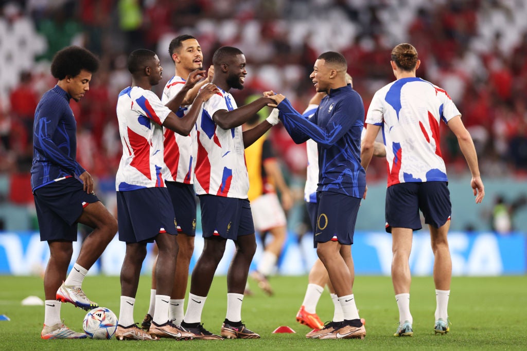 Award ceremony: UPAMECANO Dayot (FRA) walks past the trophy, cup, trophy,  disappointment, frustrated, disappointed, frustrated, rejected, left:  GUENDOUZI Matteo (FRA). Game 64, FINAL Argentina - France 4-2 nE (3-3) on  December 18th