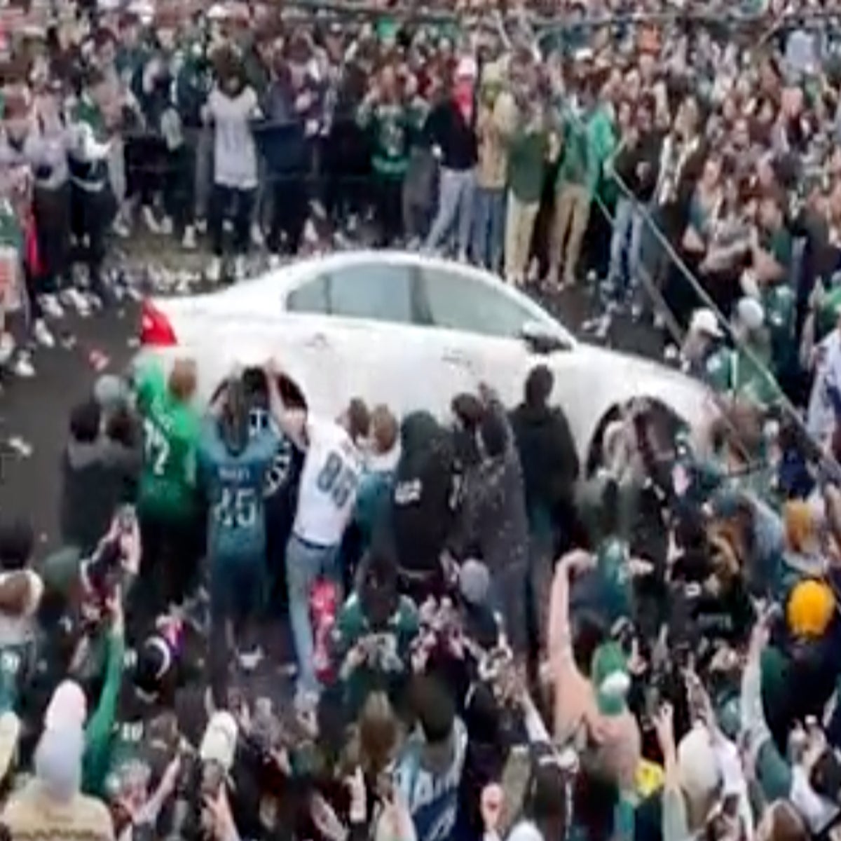 Rowdy Eagles fans flip parked car ahead of Super Bowl