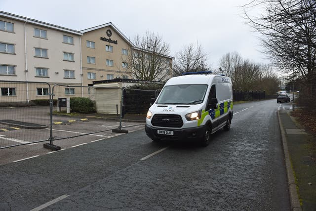 Police outside the Suites Hotel in Knowsley, Merseyside, after protestors demonstrated against asylum seekers staying at the hotel on Friday evening. Officers in Prescot, Knowsley, were dealing with two groups of protesters after a demonstration descended into chaos outside the Suites Hotel in Ribblers Lane. Picture date: Saturday February 11, 2023.