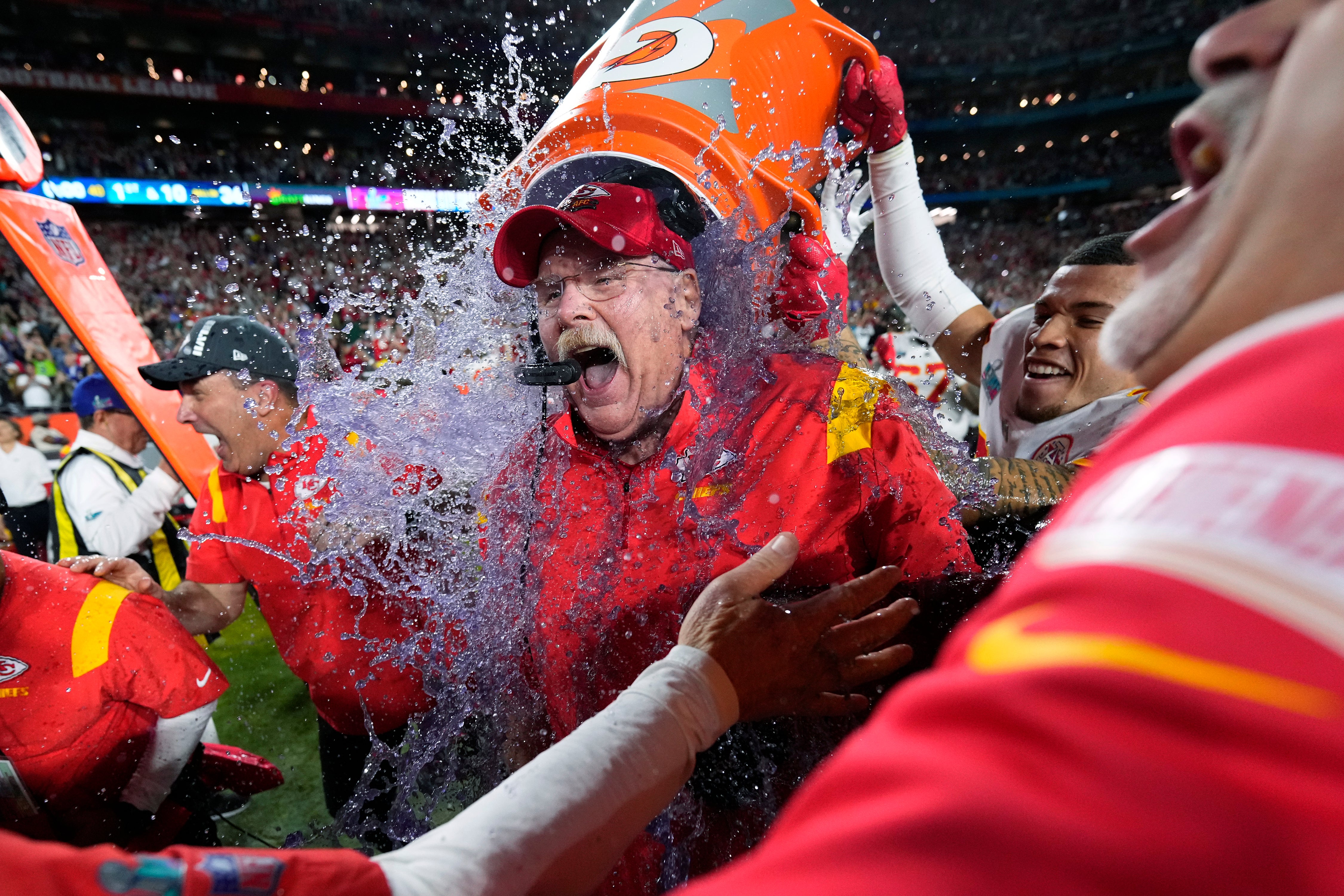 Kansas City Chiefs head coach Andy Reid is dunked after their win