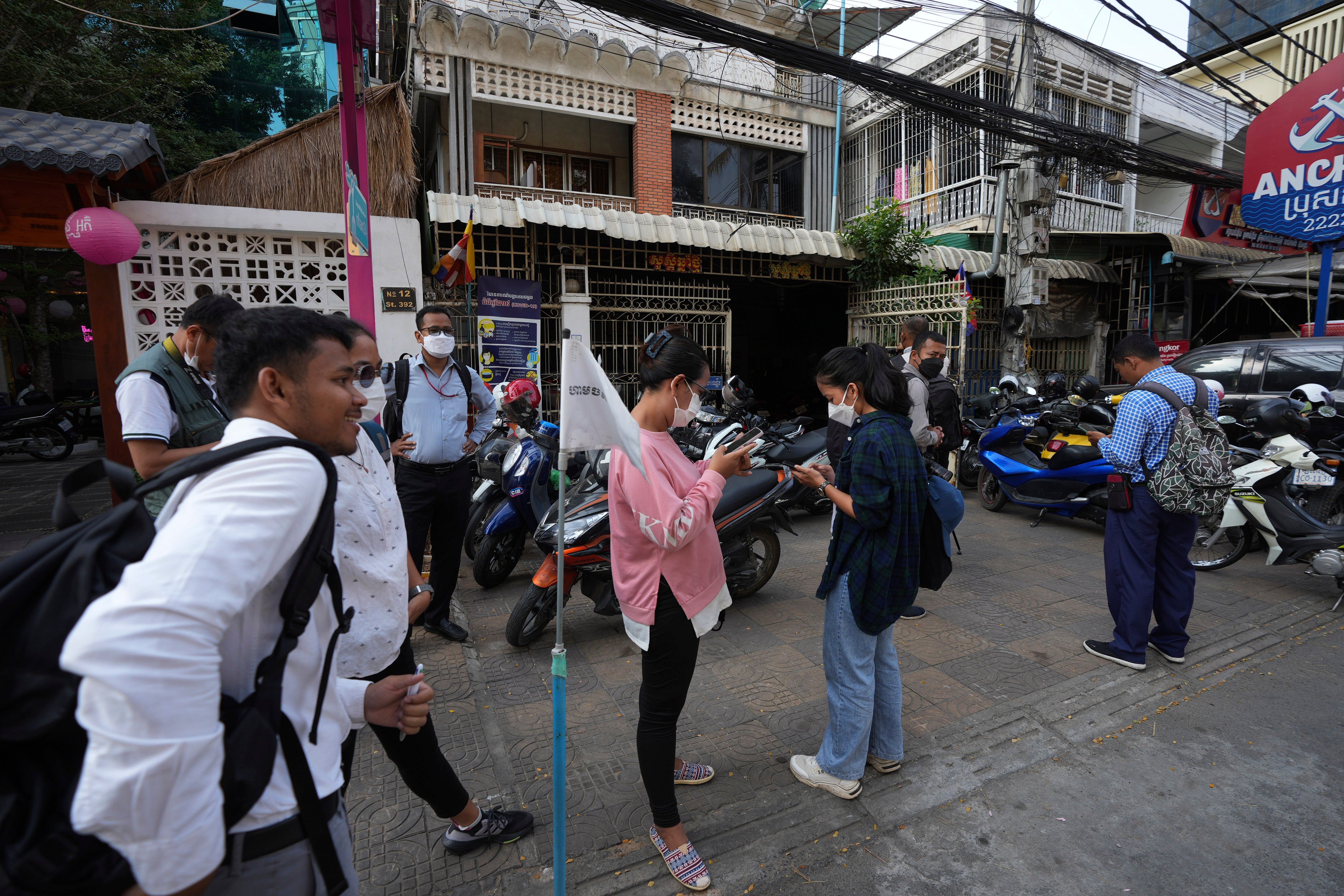 Journalists gather in front of the Voice of Democracy (VOD) office in Phnom Penh Cambodia on Monday, 13 February 2023
