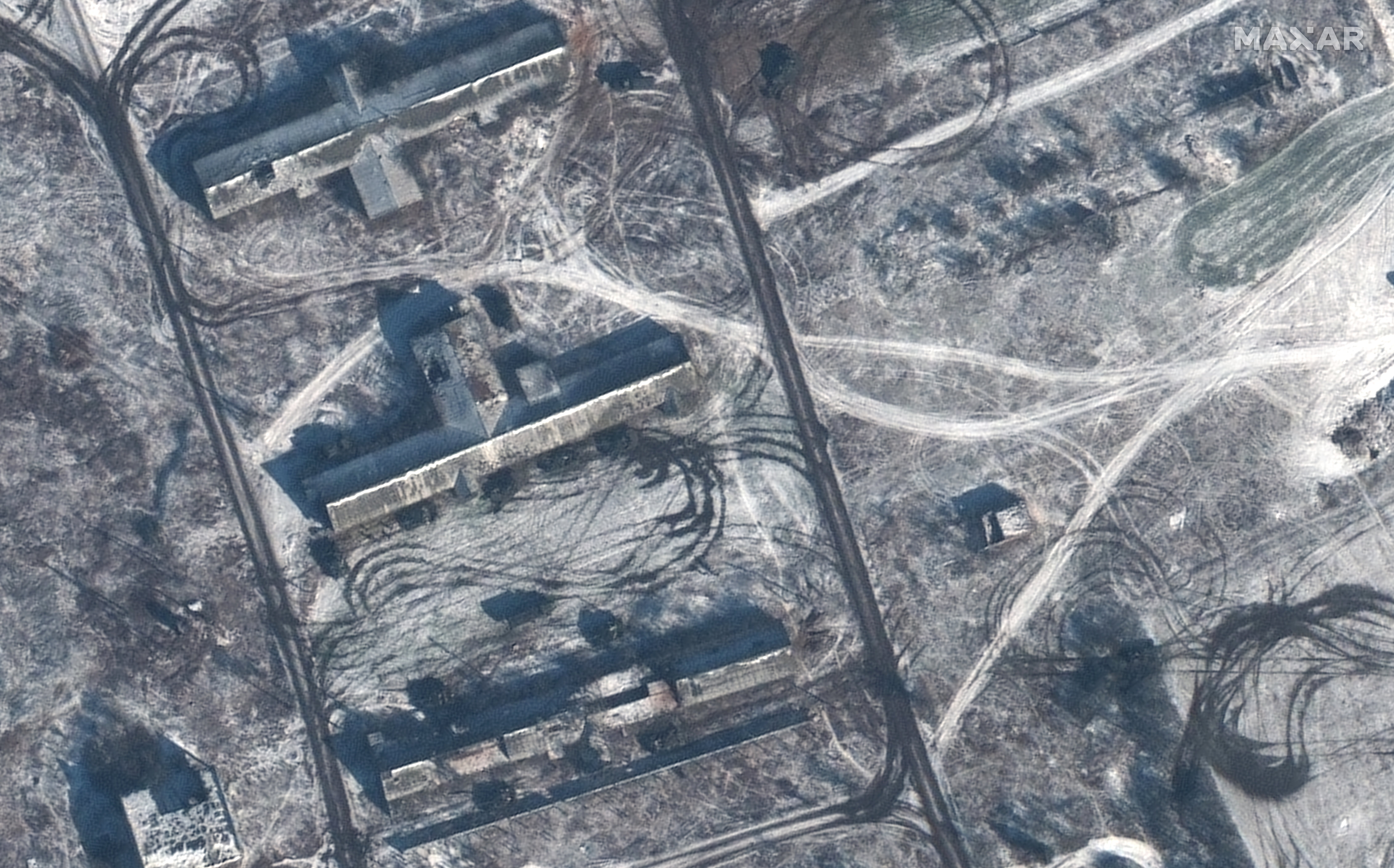 Armored vehicles positioned behind residential buildings in Krylivka, Ukraine (image captured 8 February 2023)