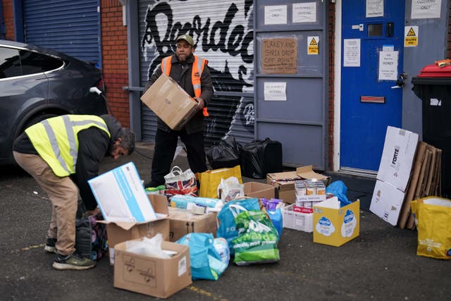 Volunteers at Bearded Broz community project drop off zone in Smethwick, West Midlands, prepare donations to send to Turkey and Syria after the devastating earthquake left hundreds of thousands displaced (Jacob King/PA)