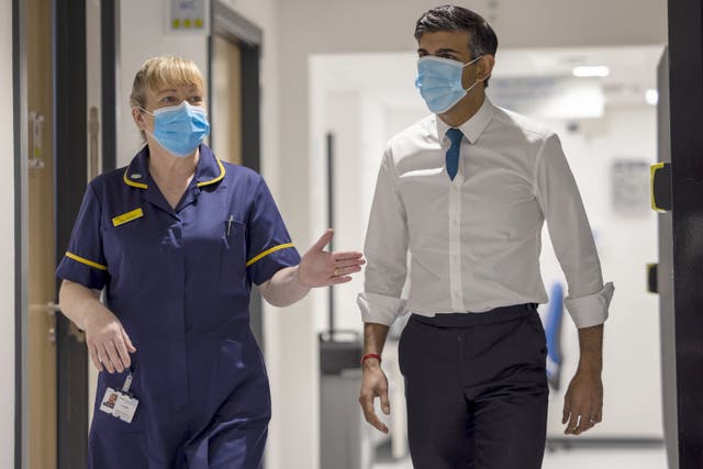 Prime Minister Rishi Sunak talks with Kay Miller, divisional director of nursing, during a visit to Oldham Community Diagnostic Centre in Oldham, Greater Manchester (James Glossop/The Times/PA)