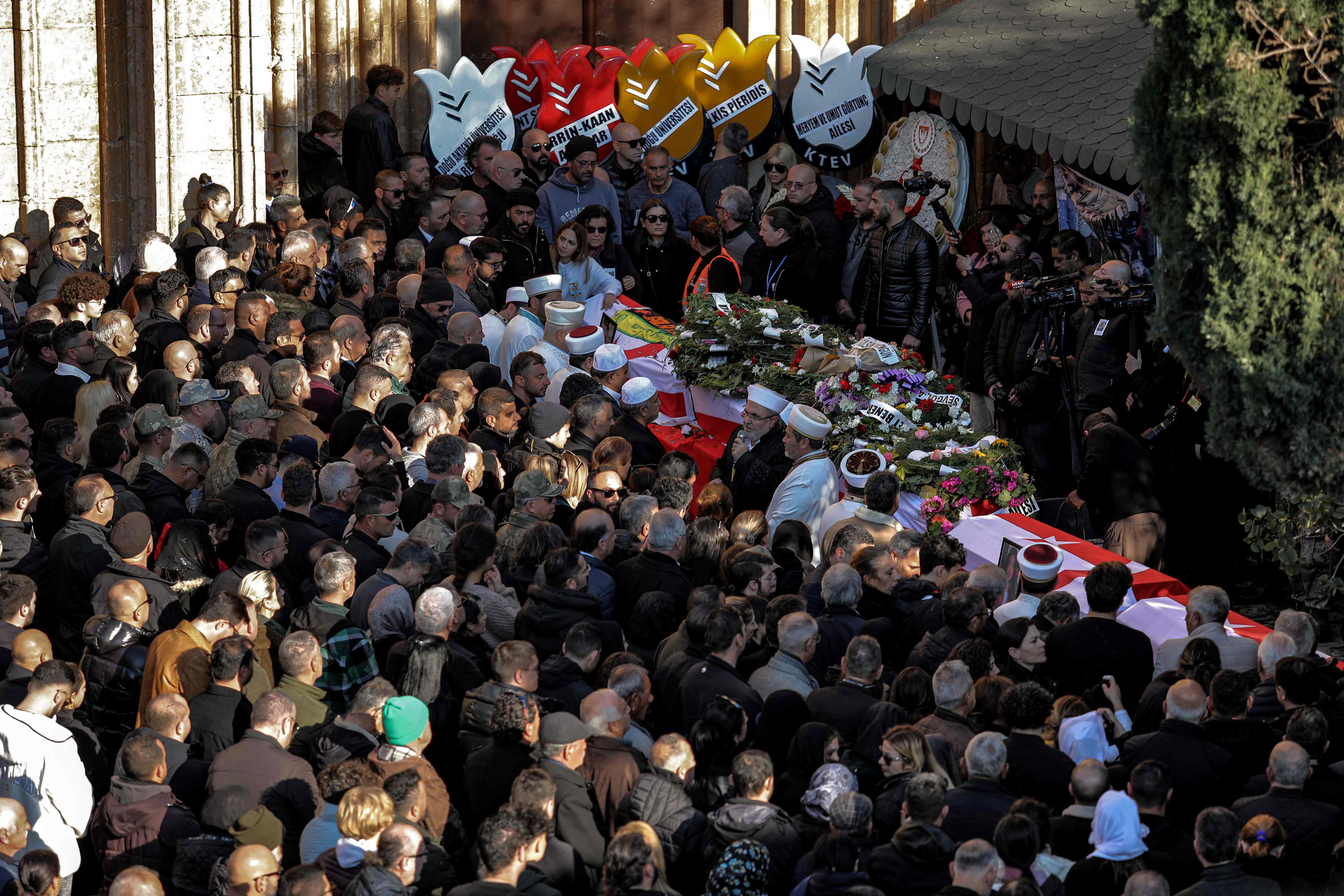 Mourners gather outside the Lala Mustafa Pasha Mosque in Cyprus' eastern city of Famagust