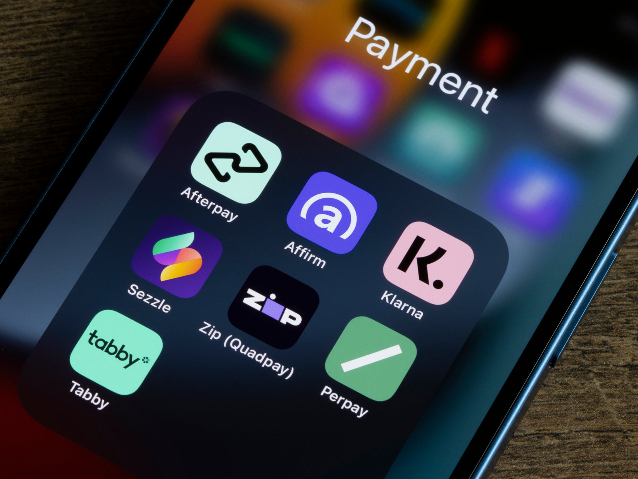 Assorted payment apps offering Buy Now Pay Later services are seen on an iPhone, including Afterpay, Affirm, Klarna, Sezzle, Zip (Quadpay), Perpay, and Tabby