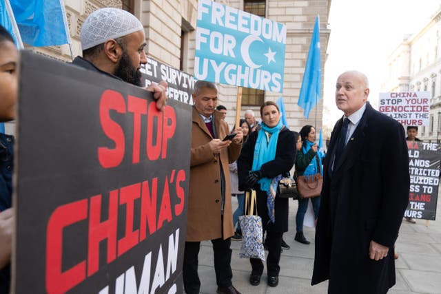 Sir Iain Duncan Smith (right) joins a vigil taking place outside the Foreign Office (Stefan Rousseau/PA)