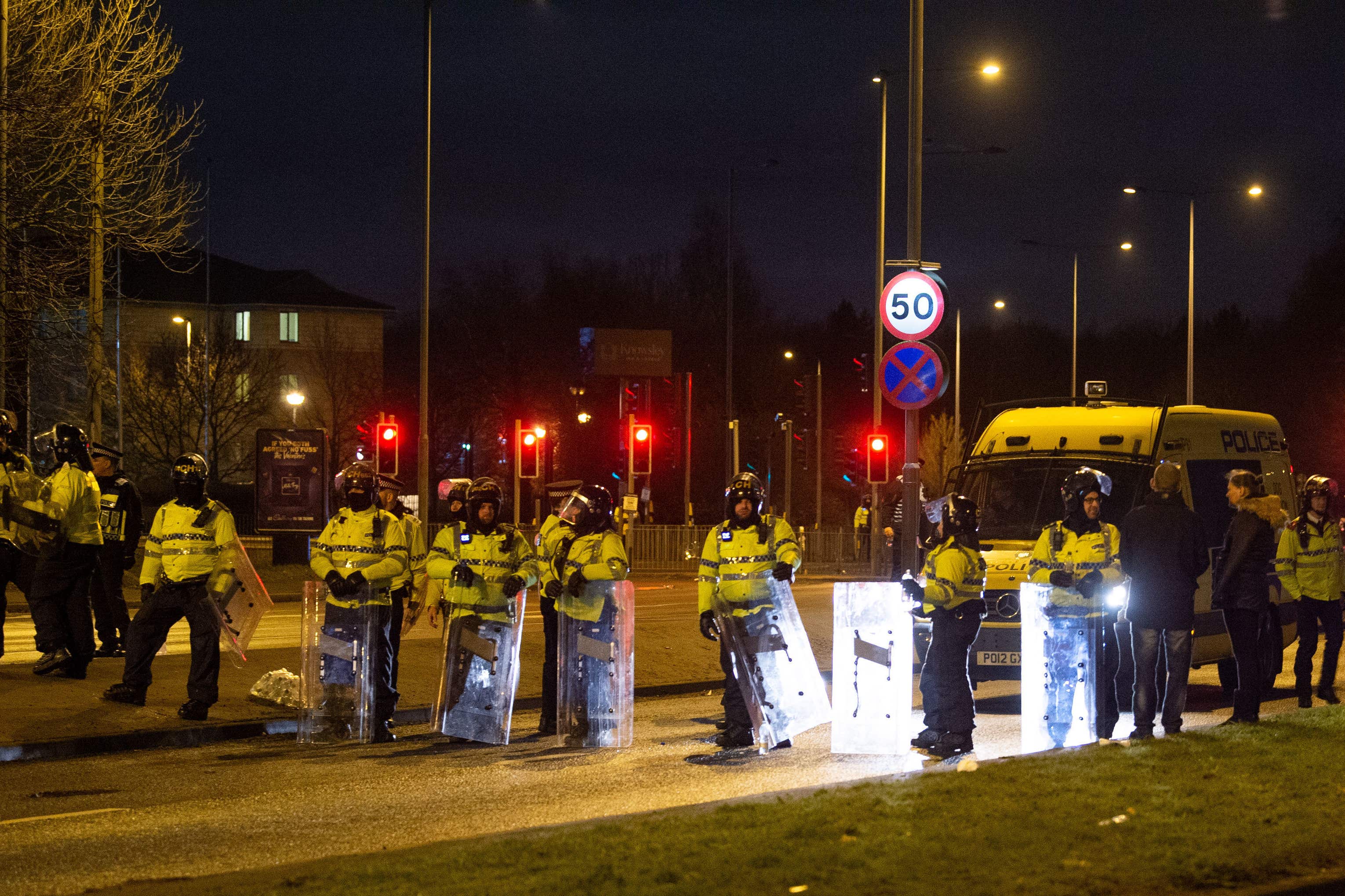 Police in riot gear after a demonstration outside the Suites Hotel in Knowsley (Peter Powell/PA)