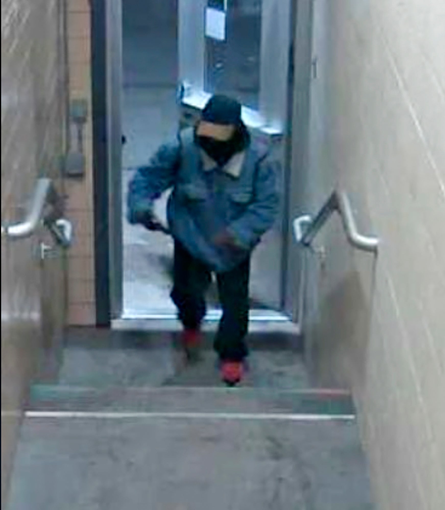 This image from surveillance video provided by Michigan State University Police and Public Safety shows a suspect whom authorities are looking for in connection with multiple shootings at the university