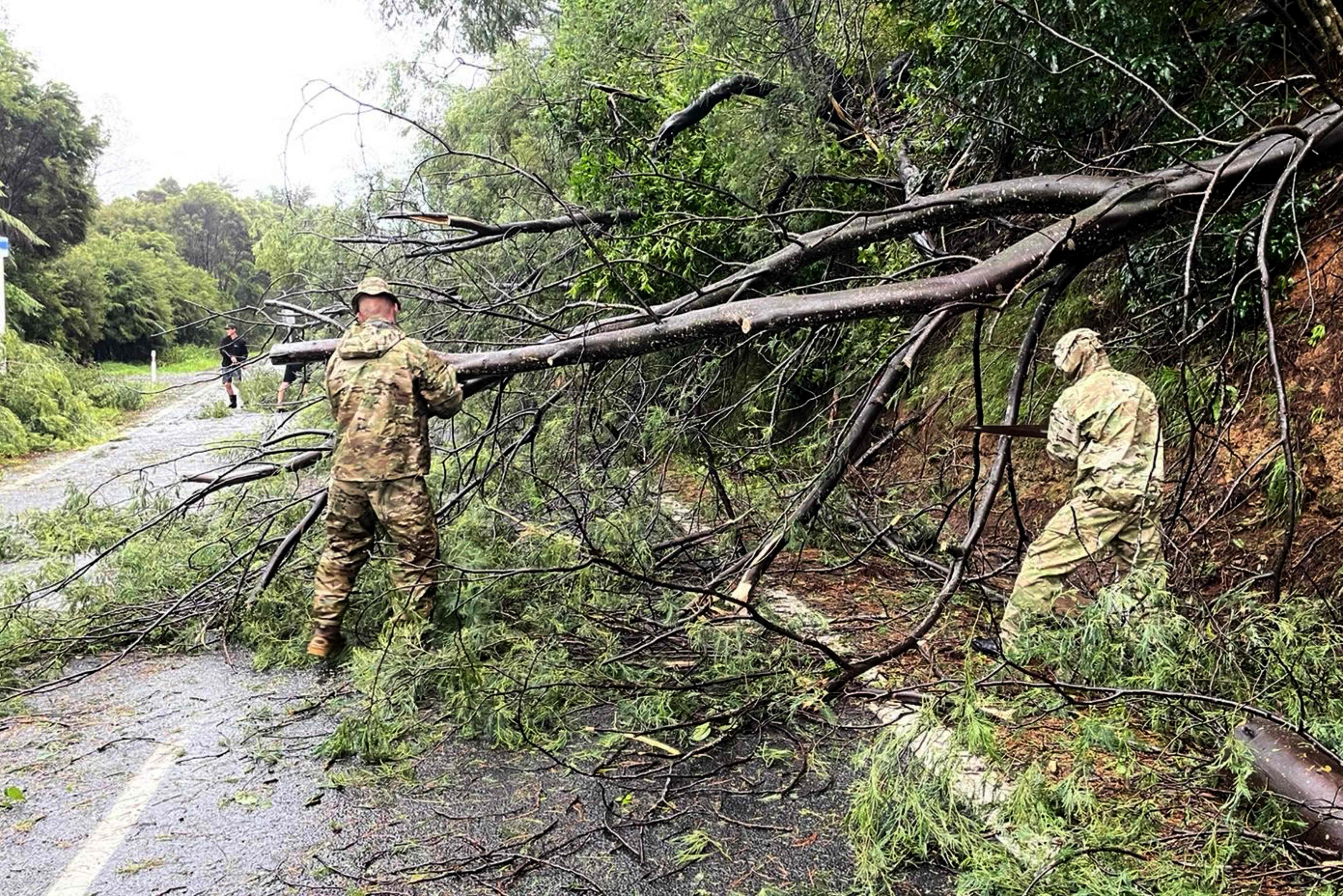 Army clearing fallen trees near Matarangi, in the Coromandel area of the North Island