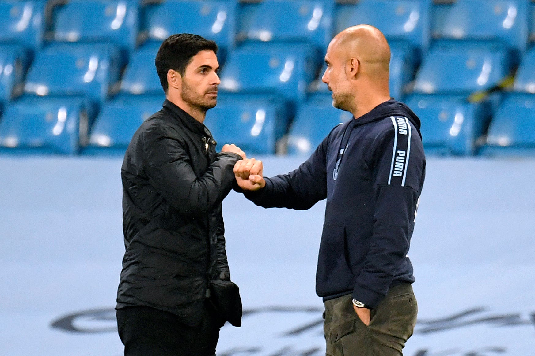 Pep Guardiola (right) greets Arsenal manager Mikel Arteta before their recent FA Cup clash