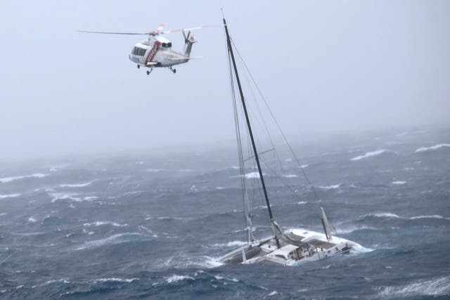 <p>A solo sailor is rescued from a yacht in the Hauraki Gulf off New Zealand’s North Island on Tuesday</p>