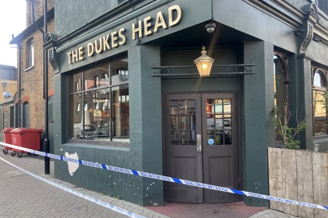 A police cordon outside The Dukes Head pub in Wood Street, Walthamstow (Timothy Sigsworth/PA)