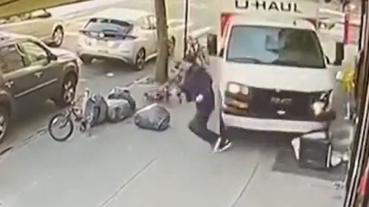 Moment pedestrian dives from path of U-Haul truck during New York police chase