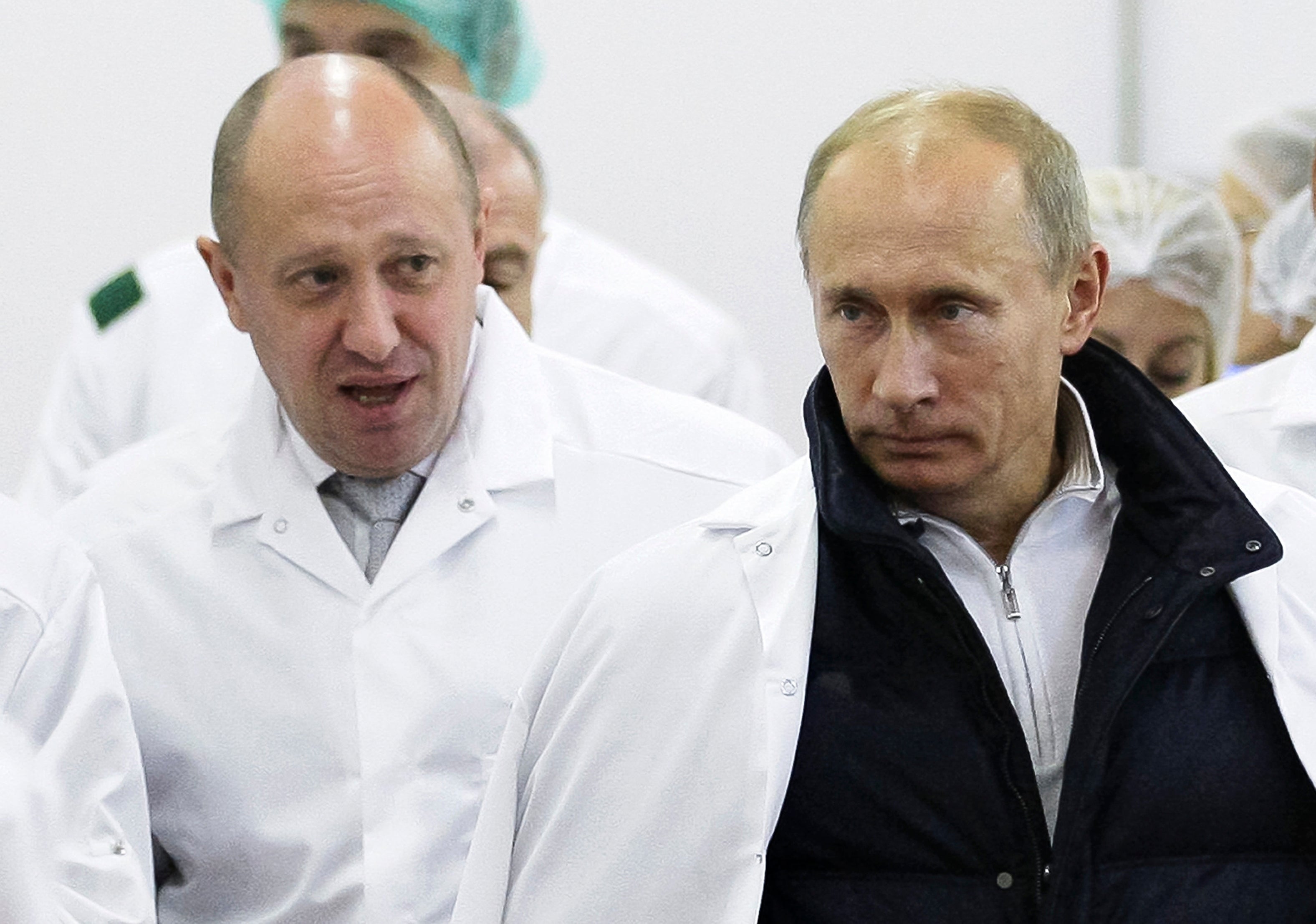 Yevgeny Prigozhin and Vladimir Putin on a tour around the former’s food factory in 2010