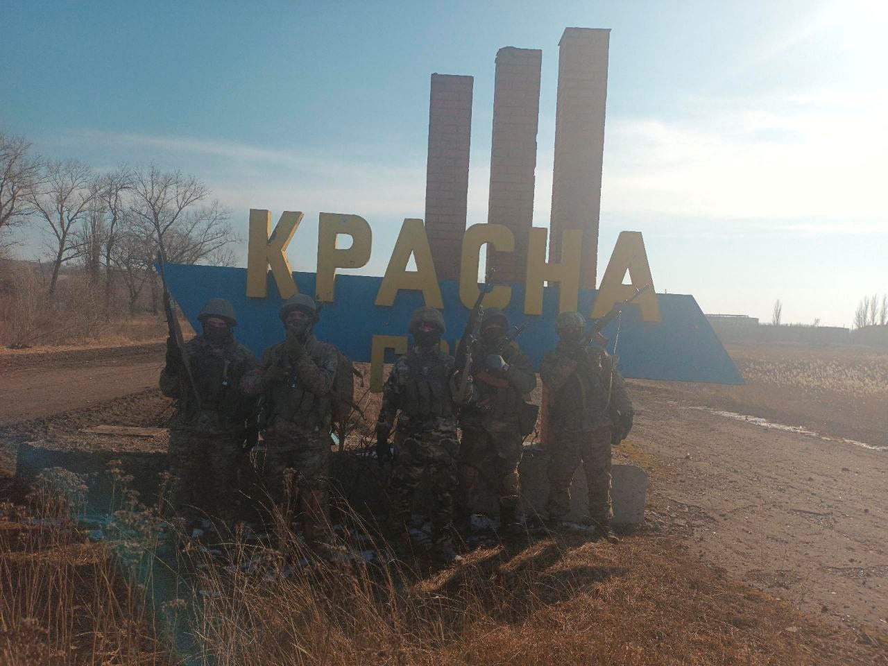 A picture released by Mr Prigozhin’s press service shows what it said were Wagner fighters at the entrance sign to the village of Krasna Hora