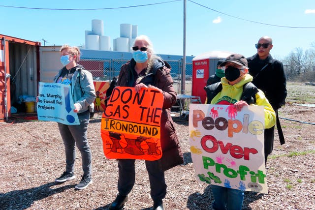 <p> Activists attend a protest against a proposed backup power plant for a sewage treatment facility, in Newark on April 20, 2022</p>