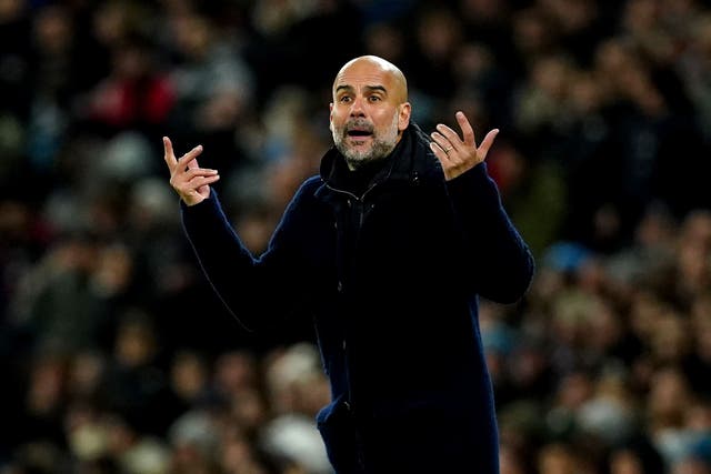Pep Guardiola is determined not to give up the title without a fight (Martin Rickett/PA)