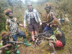 Papuan separatists armed with bows and arrows surround captured New Zealand pilot in video