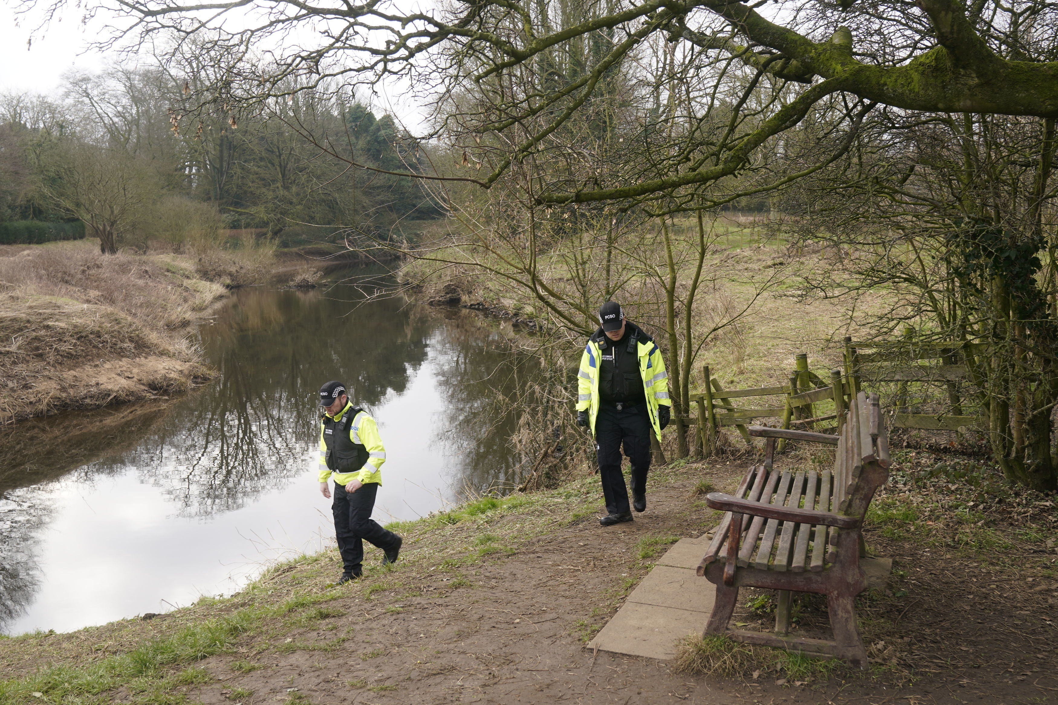 Police at the bench by the River Wyre in St Michael's on Wyre, Lancashire, where her mobile phone was found