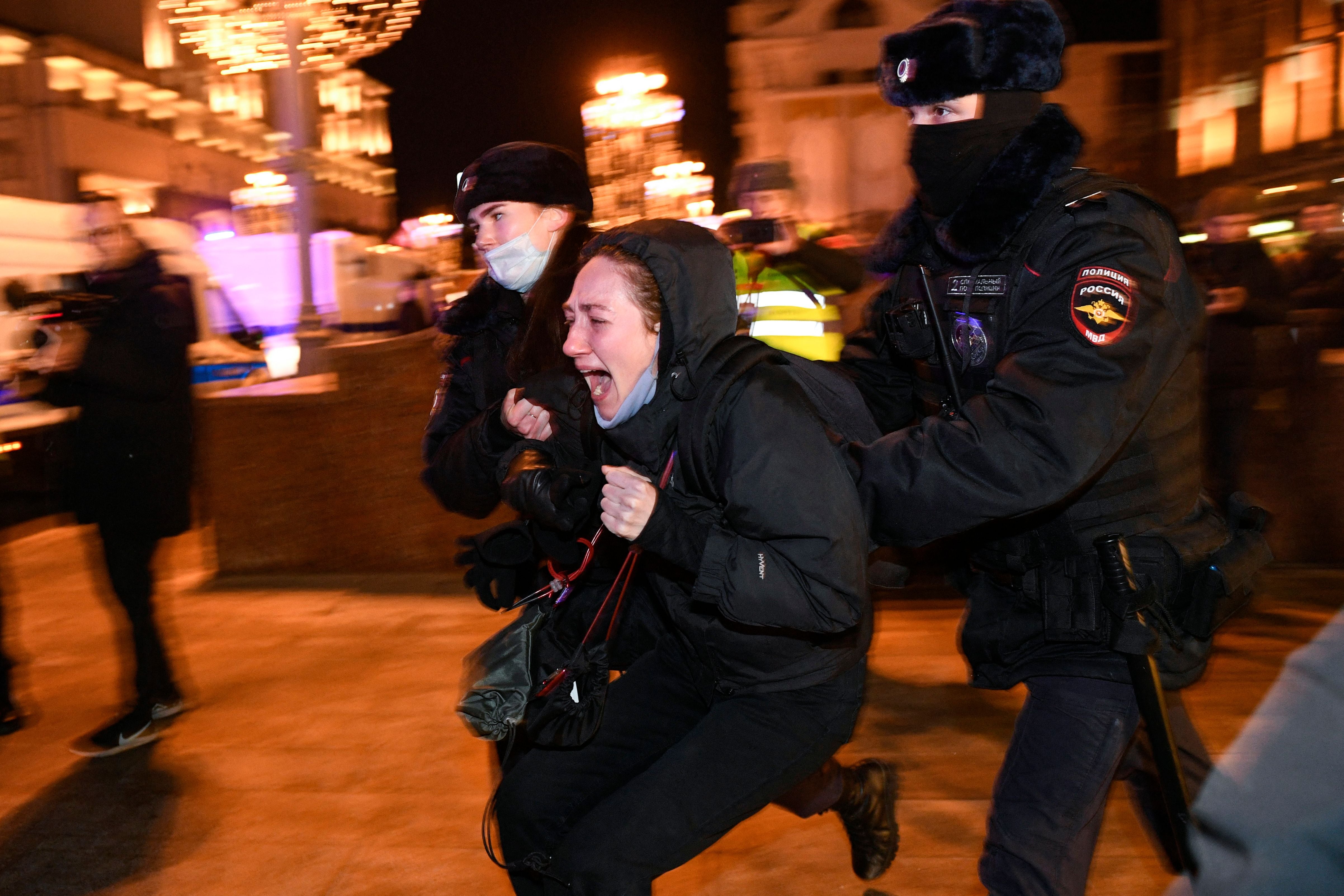 Police officers detain a demonstrator during a protest against Russia’s invasion of Ukraine in Moscow on 24 February