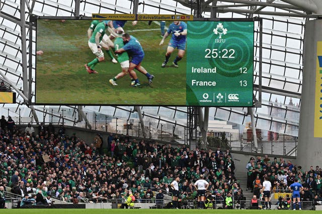 <p>English referee Wayne Barnes studies the screen after a tackle from France's prop Uini Atonio</p>