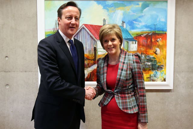 Nicola Sturgeon shakes hands with David Cameron in January 2015 (Andrew Milligan/PA)