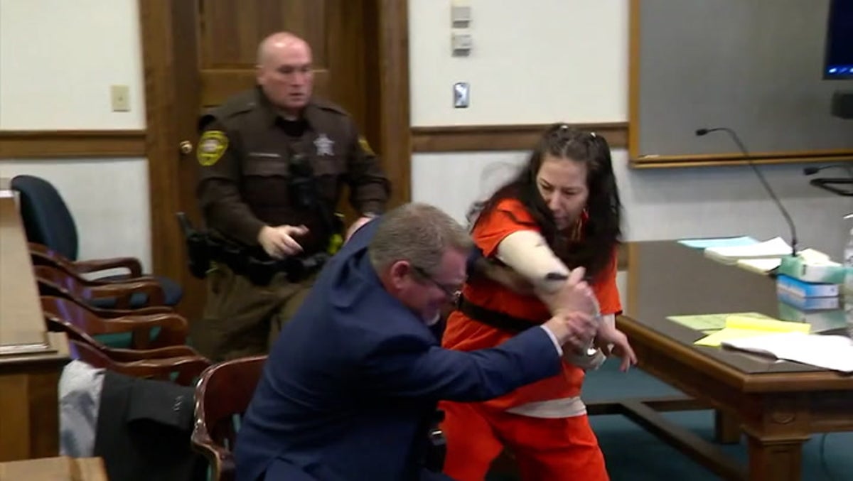 Moment woman attacks own lawyer in court whilst standing trial for decapitating lover