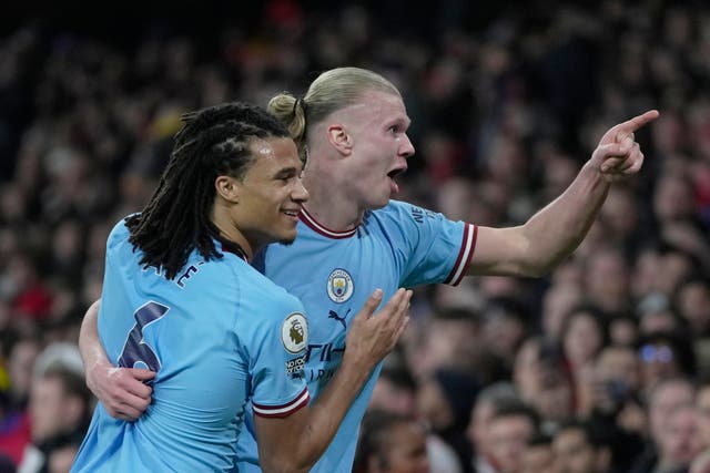 Nathan Ake celebrates with Manchester City team-mate Erling Haaland after his goal against Arsenal. (Kin Cheung/AP)
