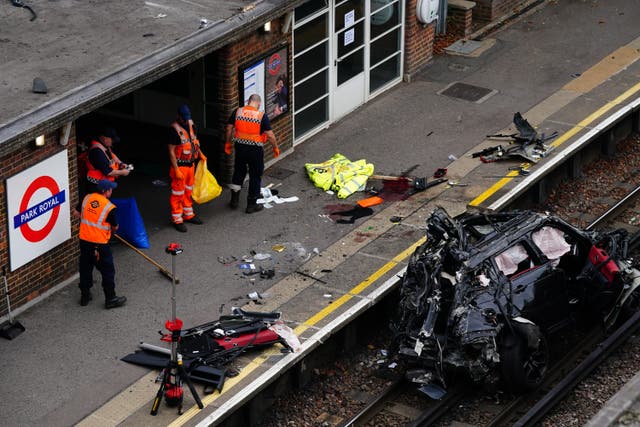 The scene of a fatal crash in Park Royal, west London, in which a Range Rover ended up on a railway track for the Piccadilly underground line (PA)
