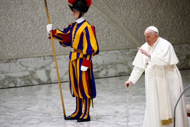 <p>Pope Francis walks with a stick at the Vatican on Wednesday</p>