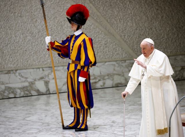 <p>Pope Francis walks with a stick at the Vatican on Wednesday</p>