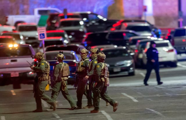 <p>File: Law enforcement agents walk in the parking lot of a shopping mall, Wednesday, Feb. 15, 2023, in El Paso, Texas</p>